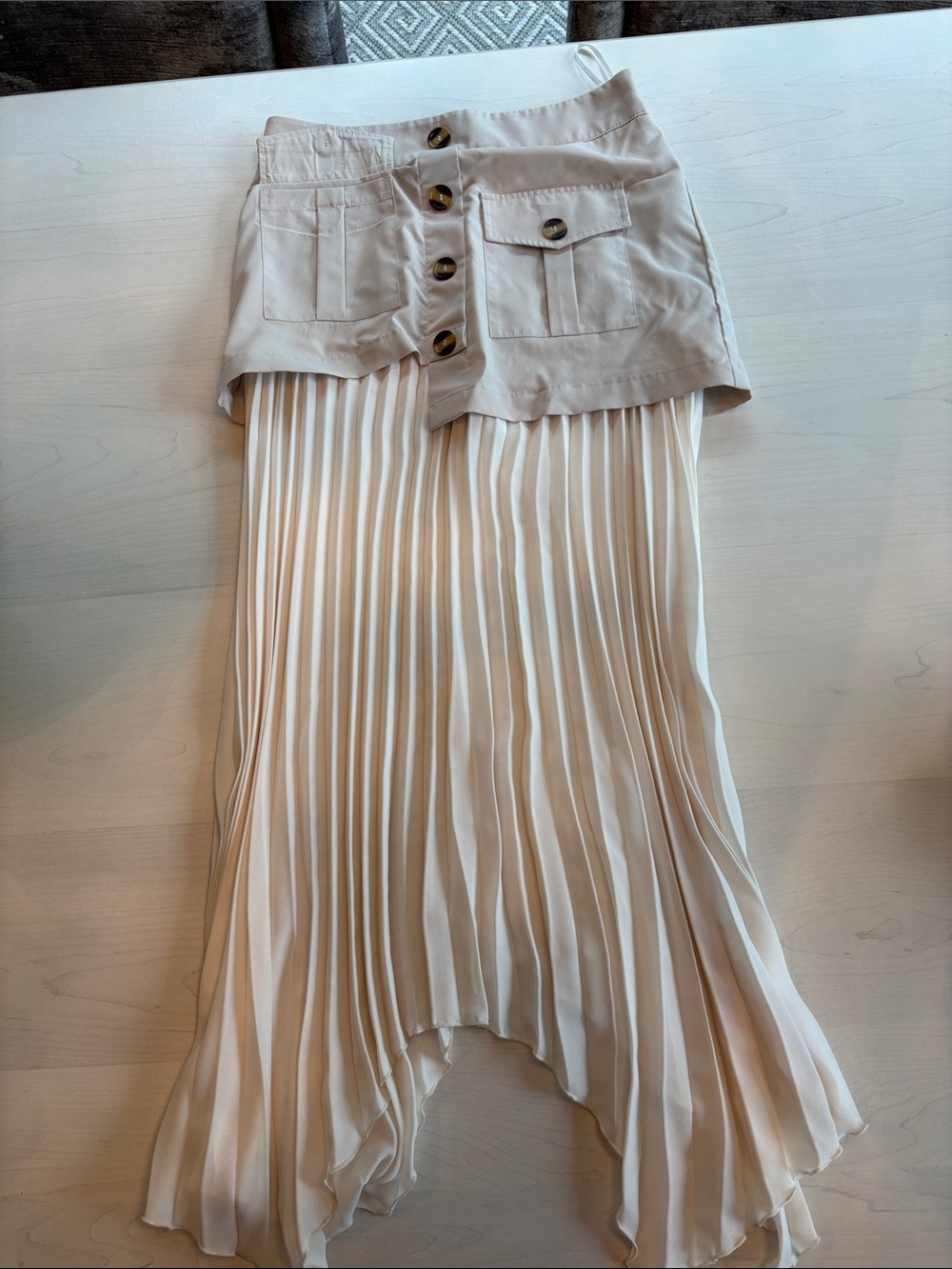 High-Low Pleated Skirt with Button-Front Waist in Cream